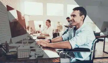 A man in a wheelchair on the path to recovery, sitting at a desk. A man in a wheelchair on the path to recovery, sitting at a desk.