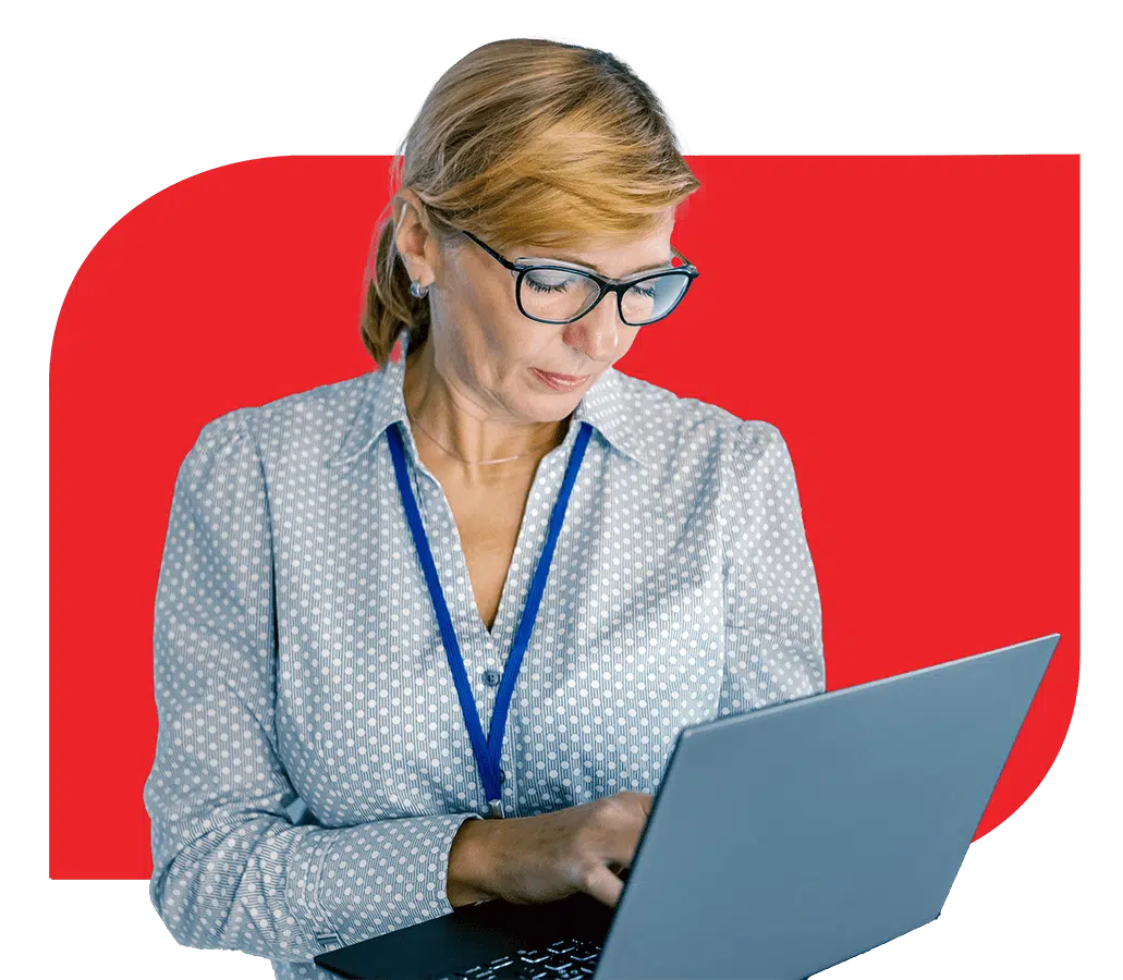 A woman in glasses is using a laptop to work on tasks related to Fogo Solutions. A woman in glasses is using a laptop to work on tasks related to Fogo Solutions.