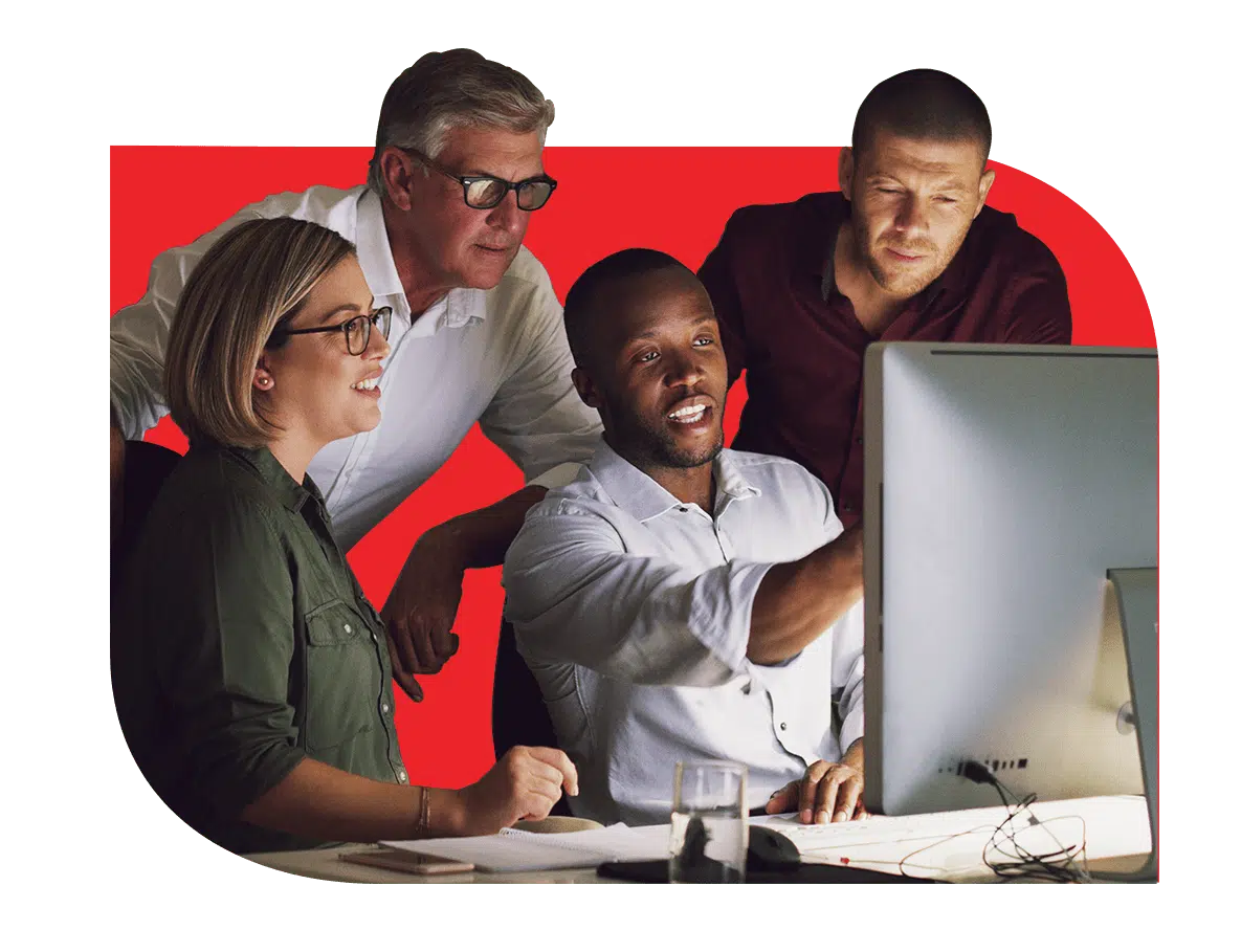 team grouped around workstation cybersecurity packages