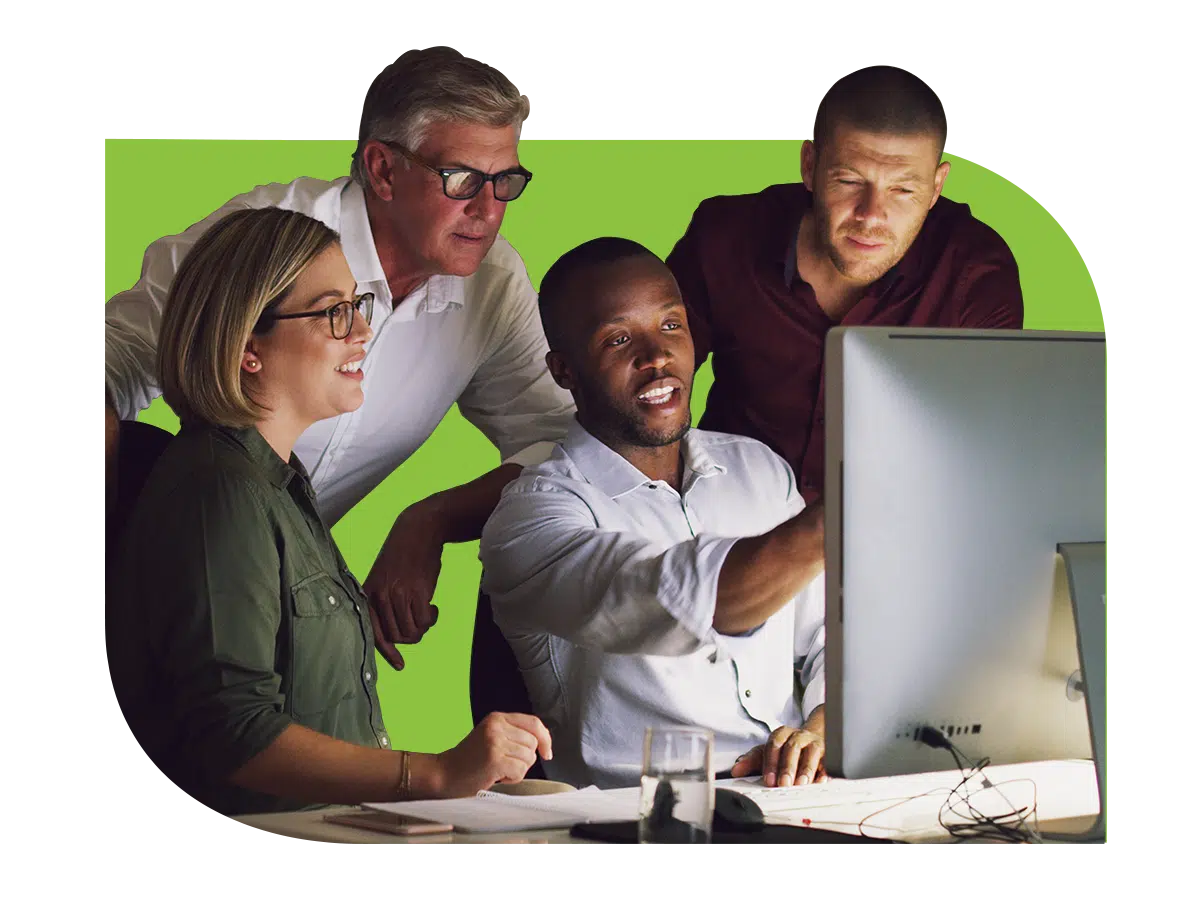 groupatwork_green group of people working around a computer screen. content creation.