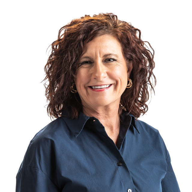 A woman in a black and white top showcasing her leadership qualities. Mandy 2025 640x640px 1